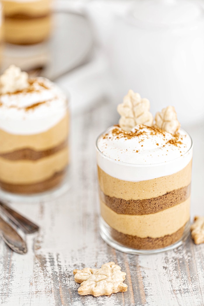 close up of a pumpkin no bake cheesecake in a jar 
