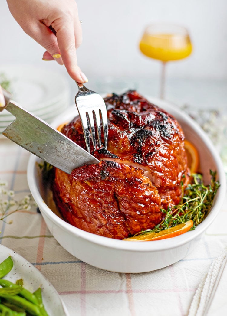 A spiral ham being sliced into