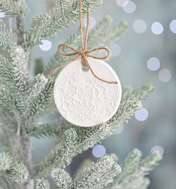 salt dough ornament on a christmas tree with lights