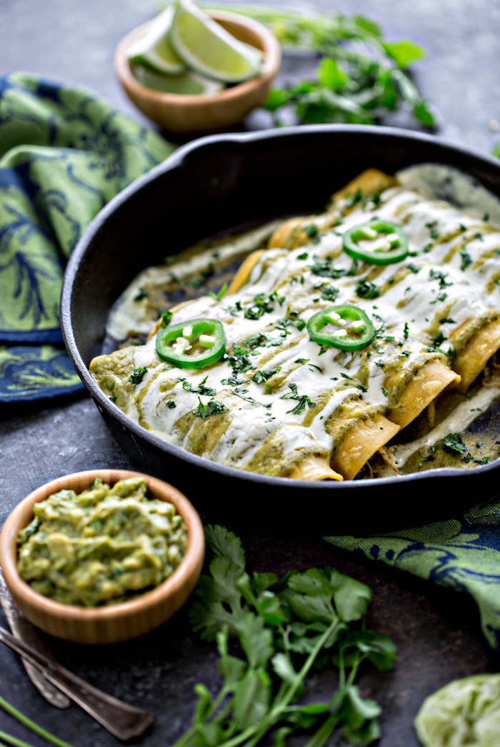 salsa verde enchiladas in a cast iron pan