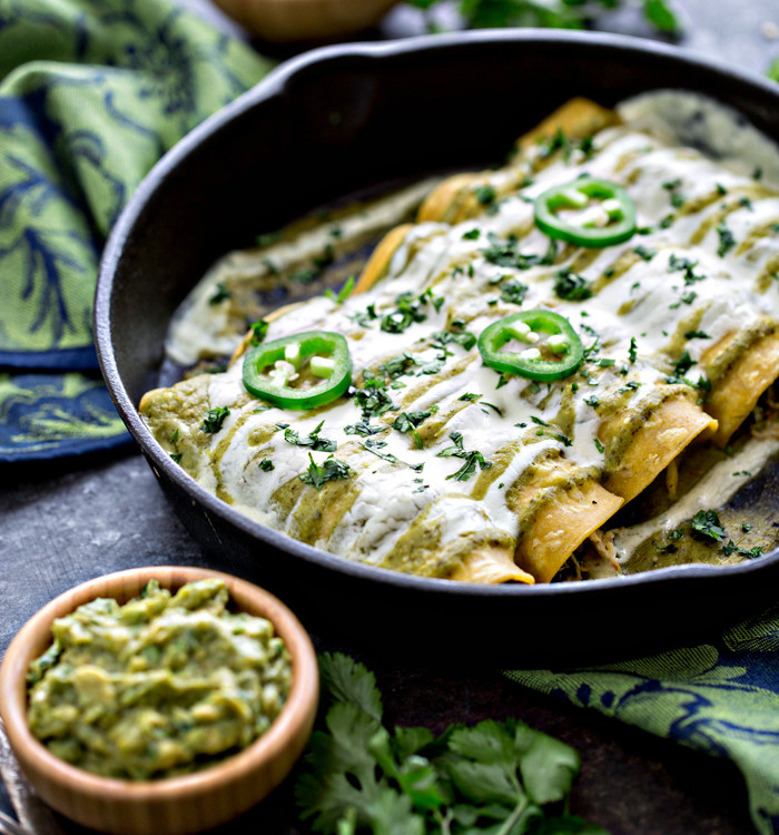 salsa verde enchiladas in a cast iron pan