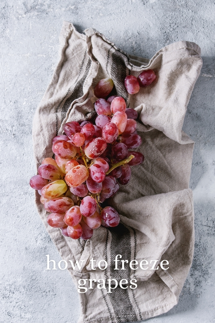 washed red grapes on a towel