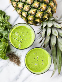 Green smoothie in a glass with kale and pineapple