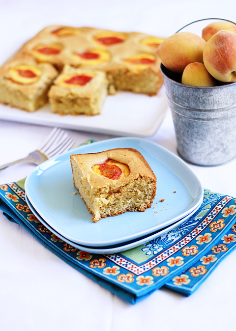 blue plate with a slice of peach cake