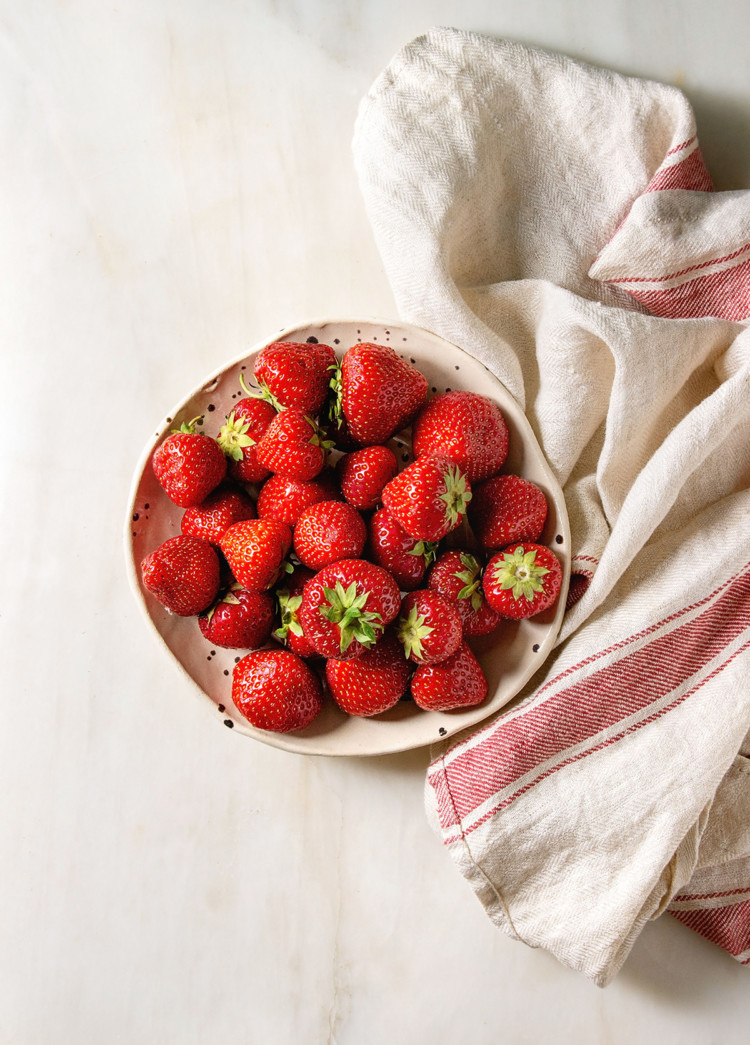 fresh strawberries preparing to be frozen