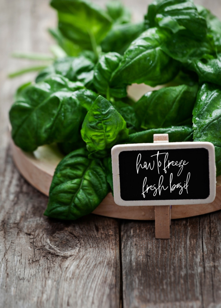 fresh basil on a wooden cutting board