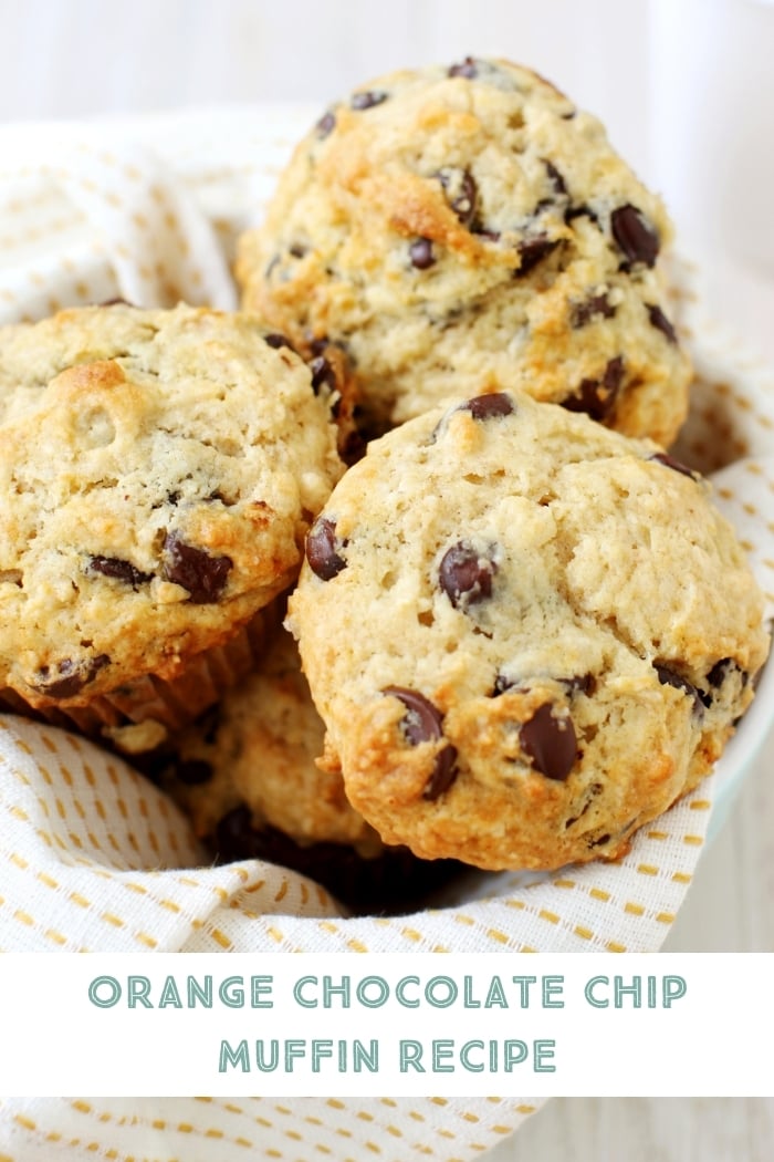 a basket of orange chocolate chip muffins