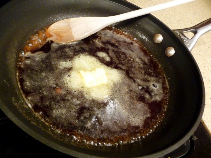 A skillet full of melted butter.