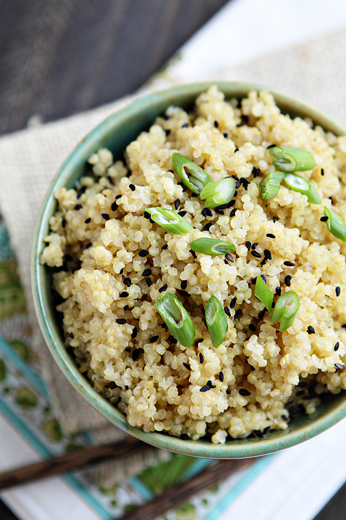 overhead shot of coconut quinoa with green onions and black sesame seeds