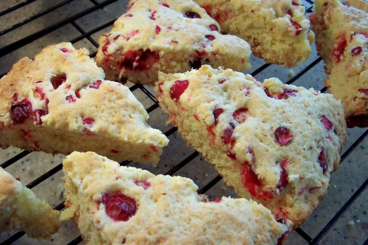 Unglazed cranberry and orange scones on a wire cooling wrack