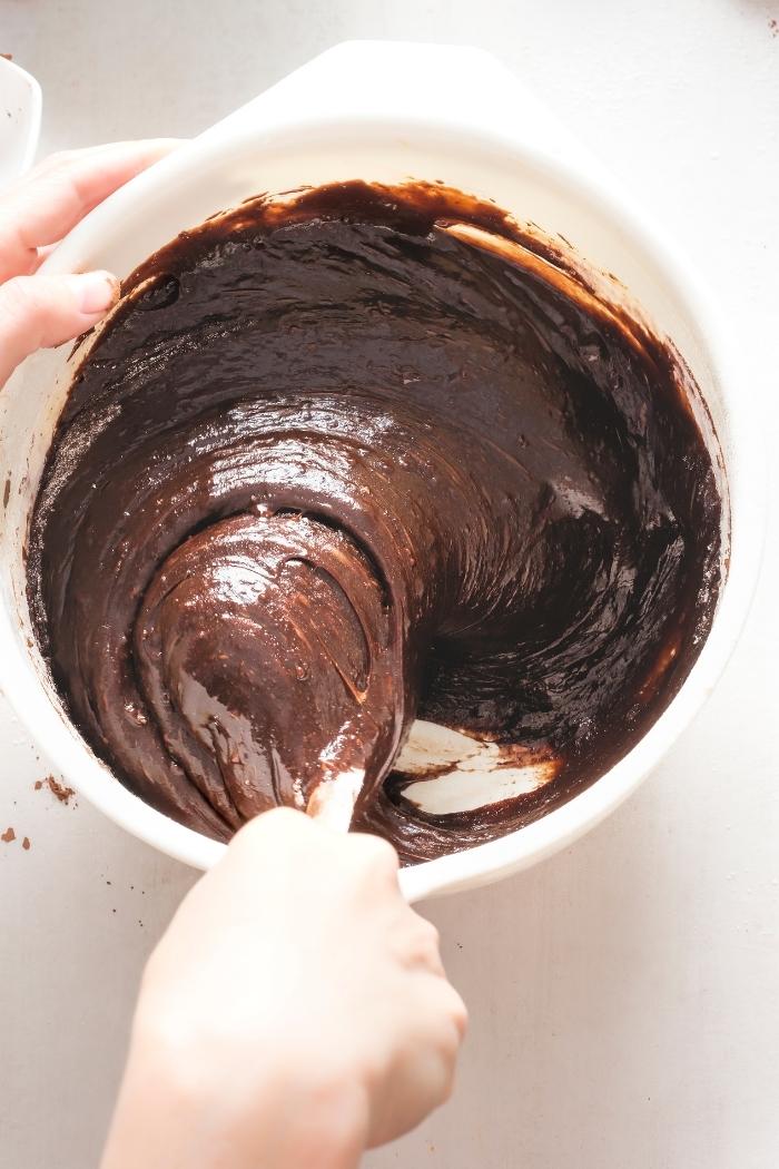 woman stirring brownie batter for easy homemade brownies