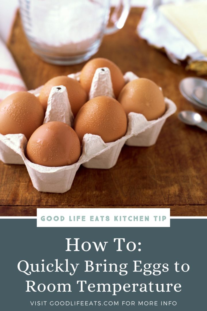 a photo of eggs in a carton on a cutting board