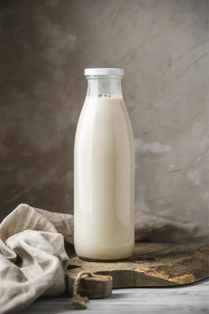 bottle of buttermilk on a cutting board