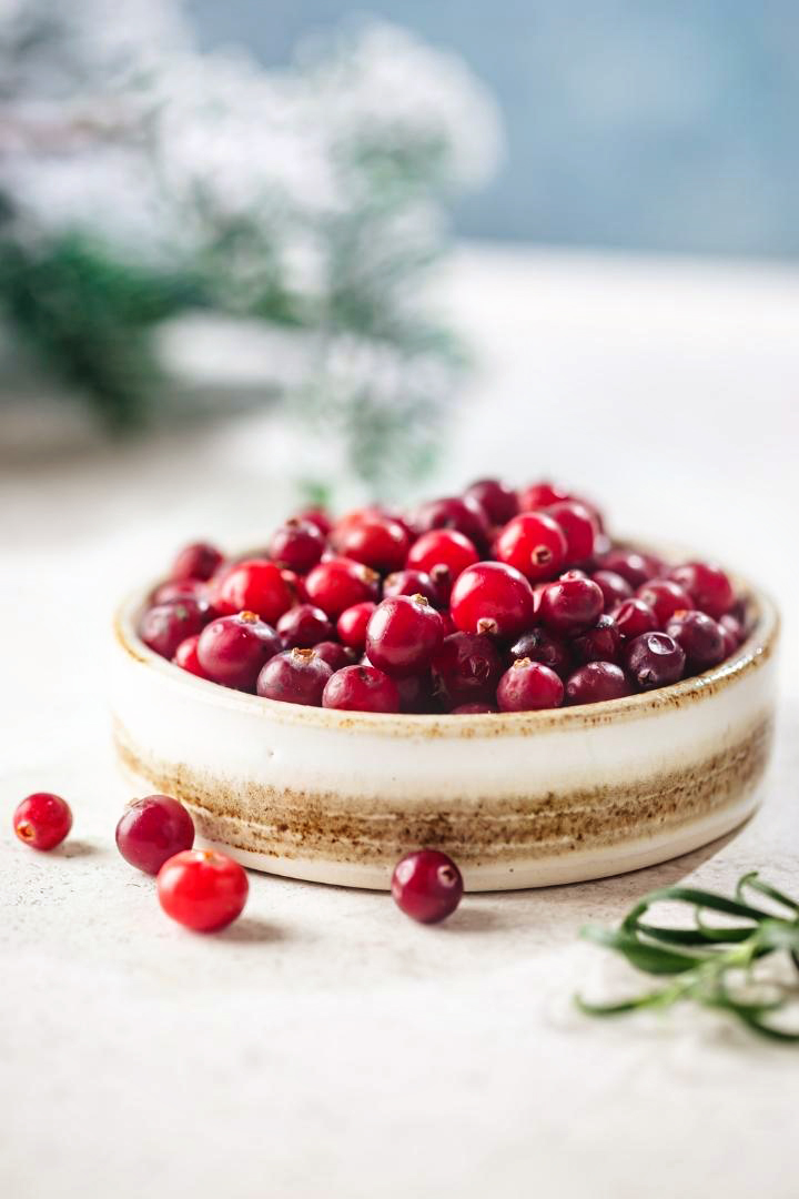 fresh cranberries in a decorative bowl
