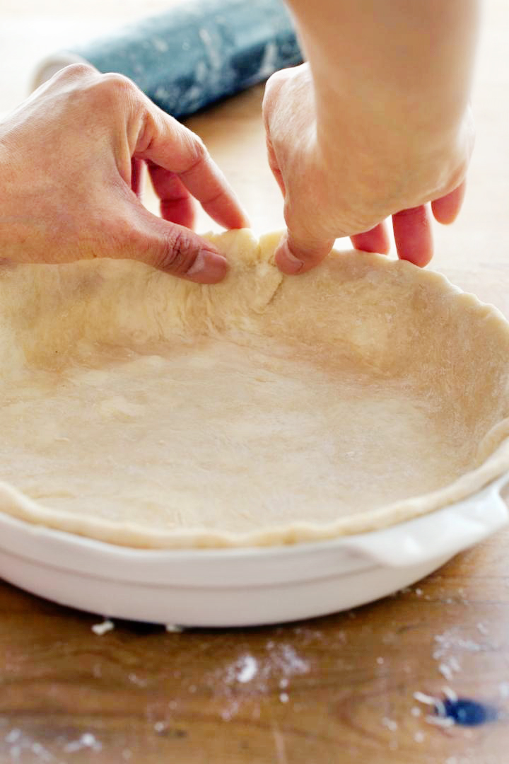 woman preparing pie dough