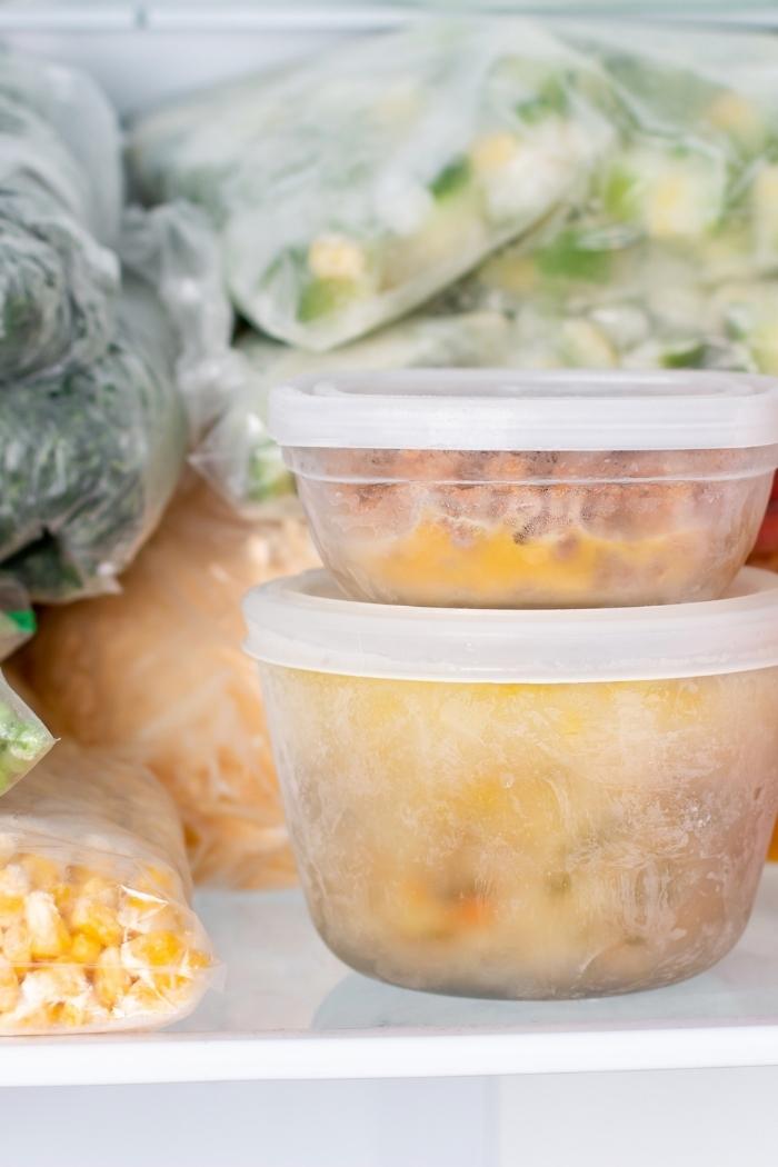 frozen soup in tupperware in the freezer