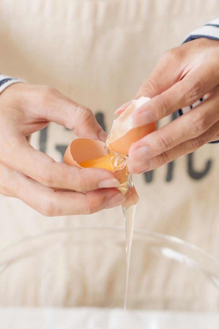 a person separating eggs