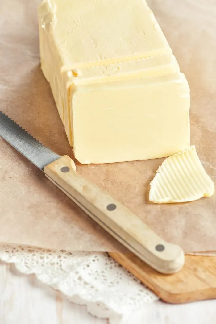 butter on a cutting board with knife