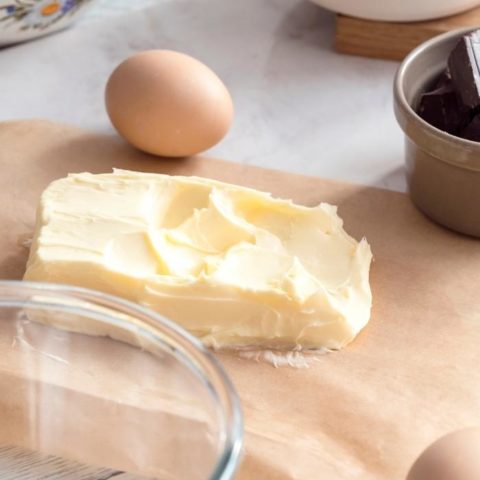 soft butter on a kitchen counter with baking ingredients