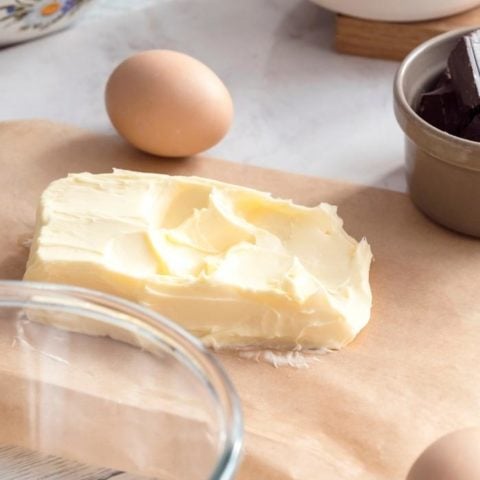 soft butter on a kitchen counter with baking ingredients