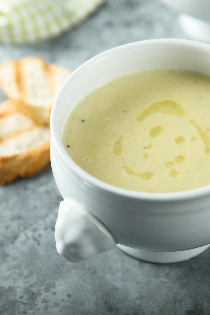 white bowl of potato leek soup