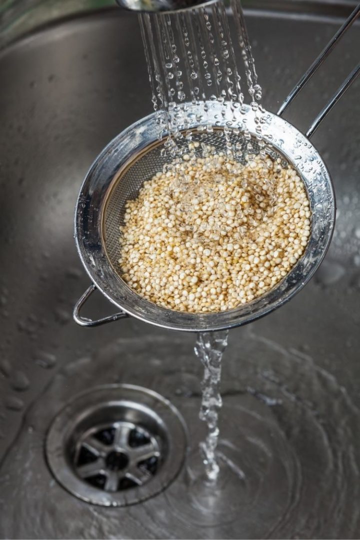 rinsing quinoa in strainer before cooking it in an instant pot
