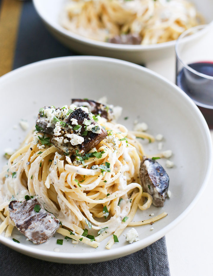 close up of a bowl of gorgonzola pasta with beef tenderloin chunks