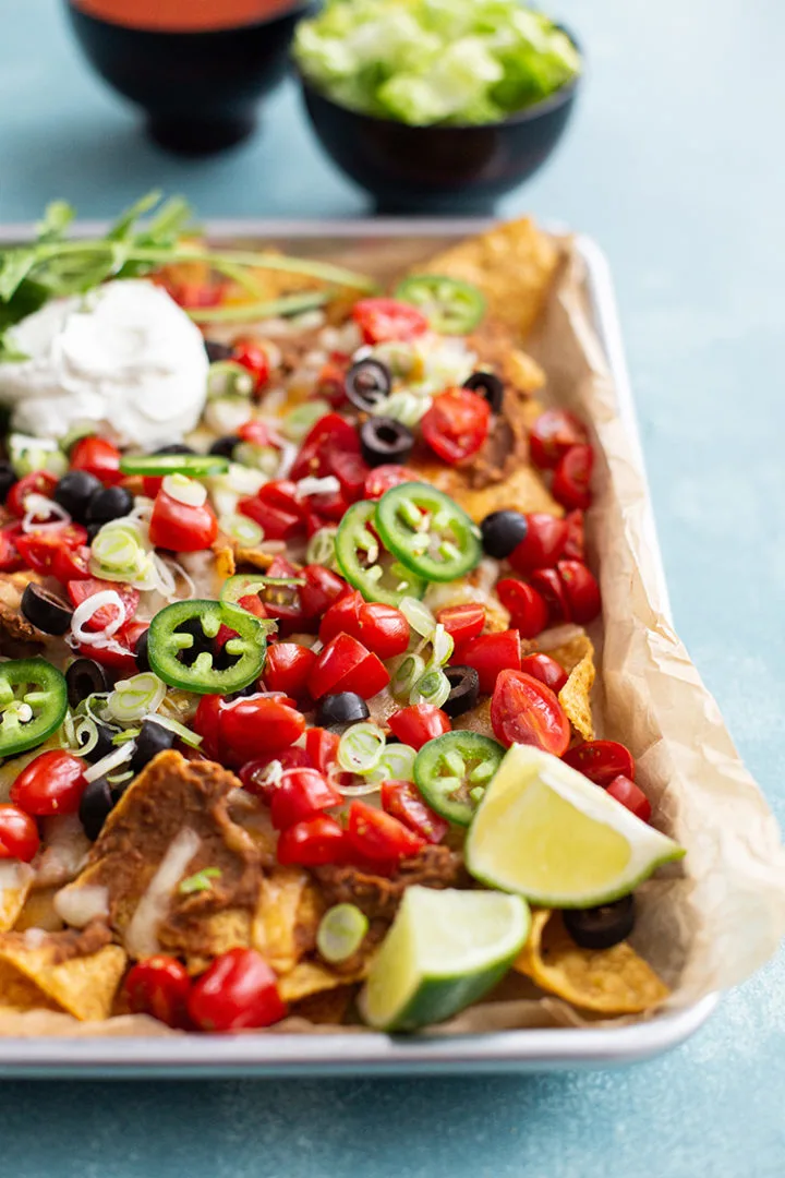 close up photo of the best nachos recipe on a baking sheet after cooking