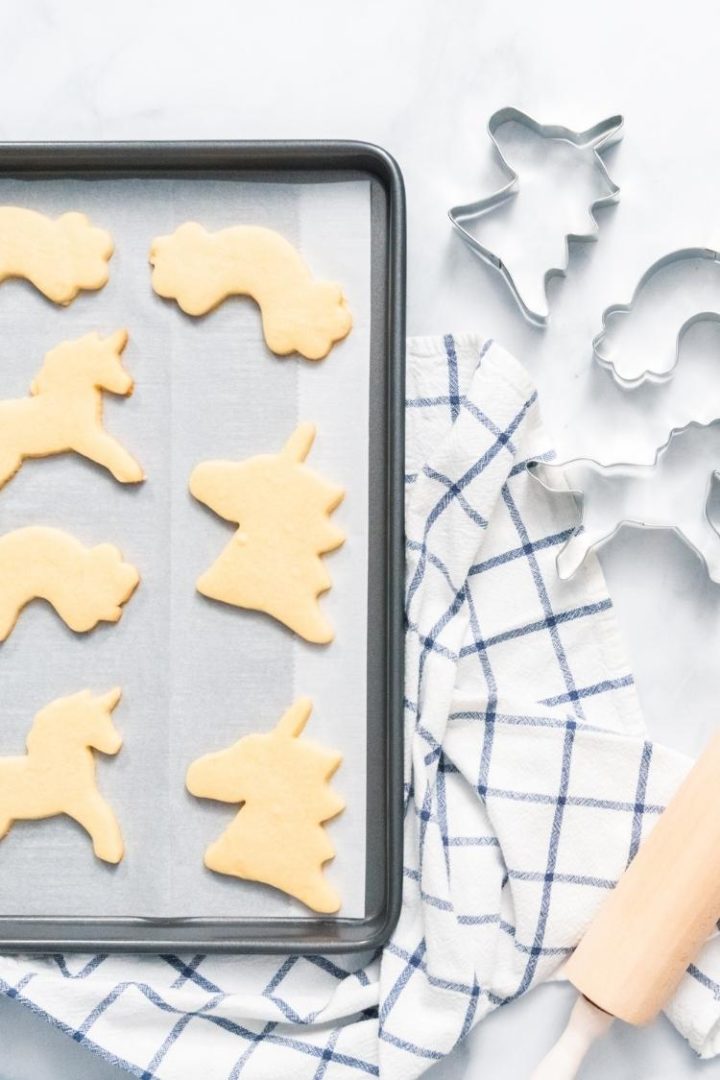 image of how to freeze cookie dough: cut out cookie on a lined baking sheet for freezing