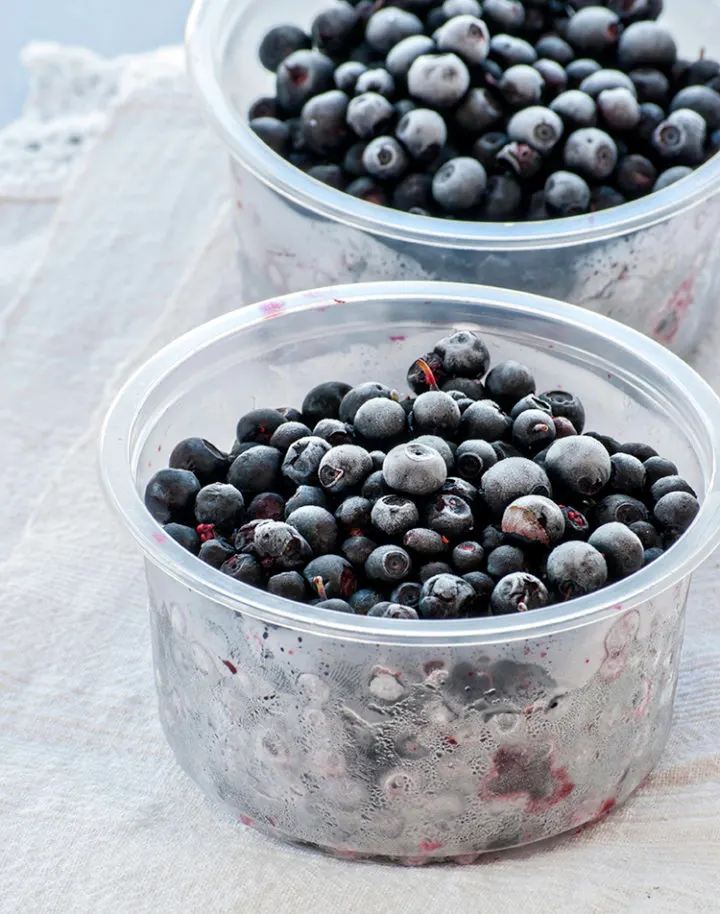 containers of frozen blueberries thawing