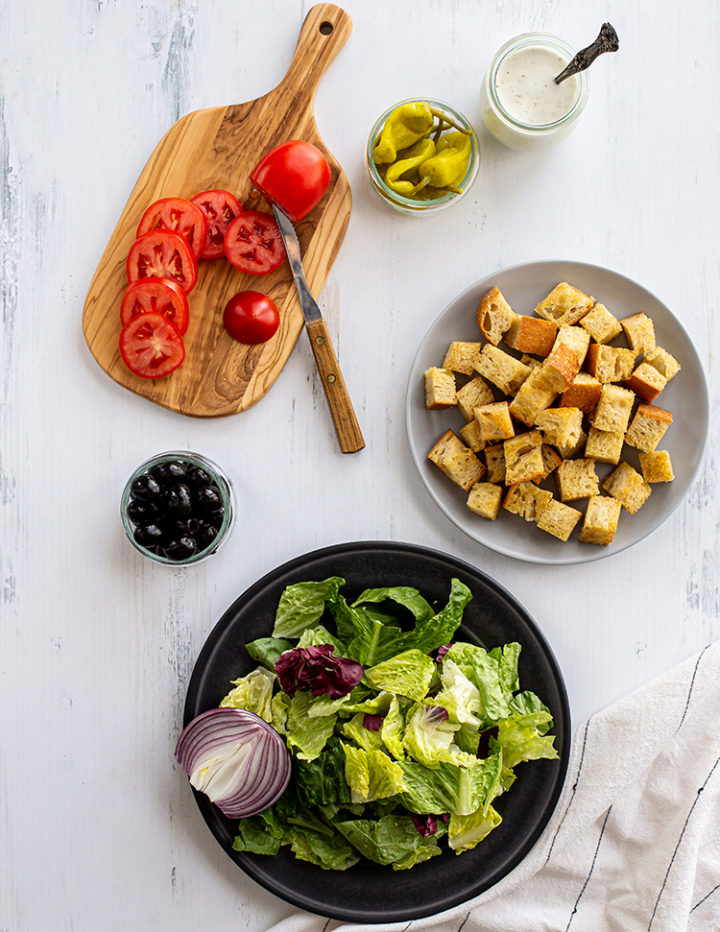 overhead shot of the ingredients to make an olive garden salad recipe