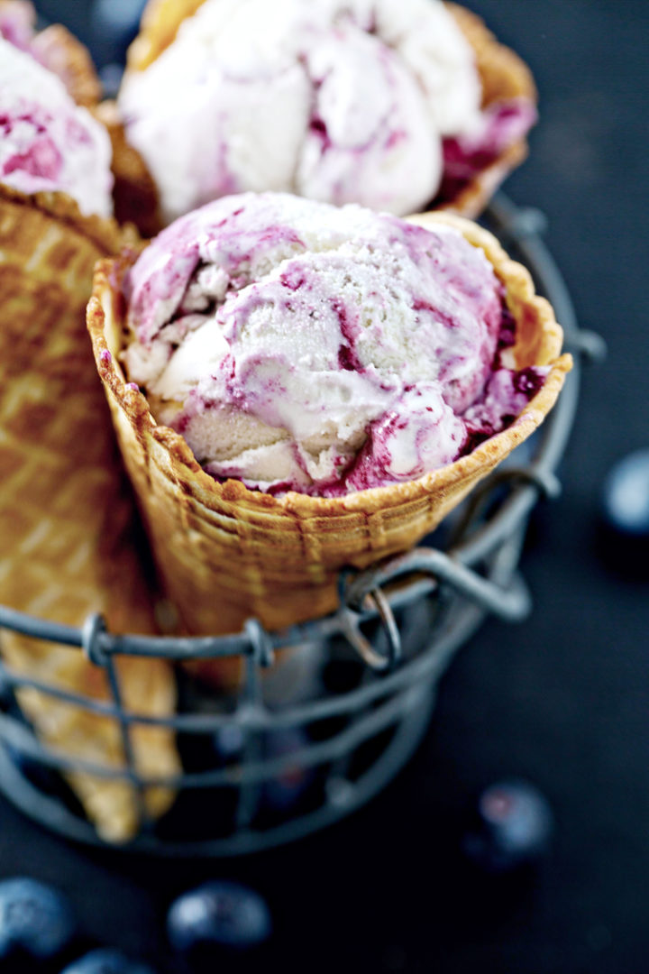 photo of blueberry cheesecake ice cream in ice cream cones