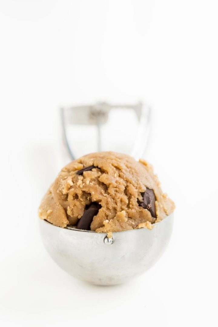 close up shot of cookie dough in a cookie scoop 