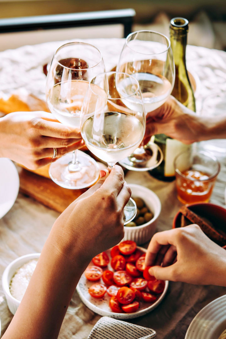 a group toasting with wine during a meal