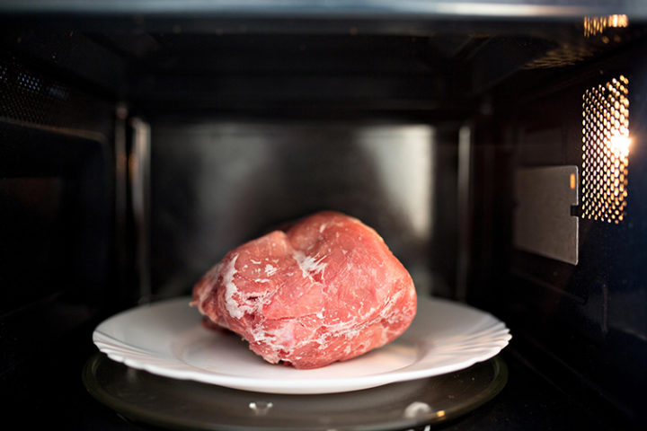 photo of meat defrosting in the microwave