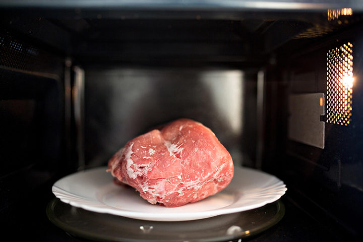 photo of meat defrosting in the microwave