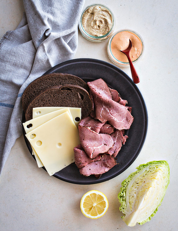 overhead shot of reuben sandwich ingredients using leftover corned beef 