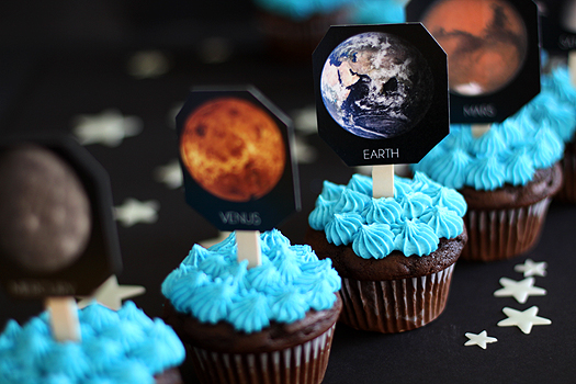 photo of decorated planet cupcakes for a space themed birthday party