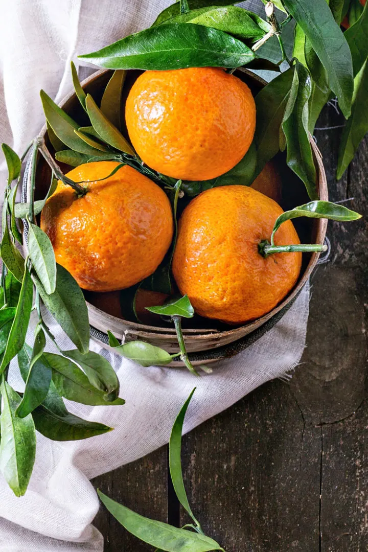 photo of fresh oranges in a basket