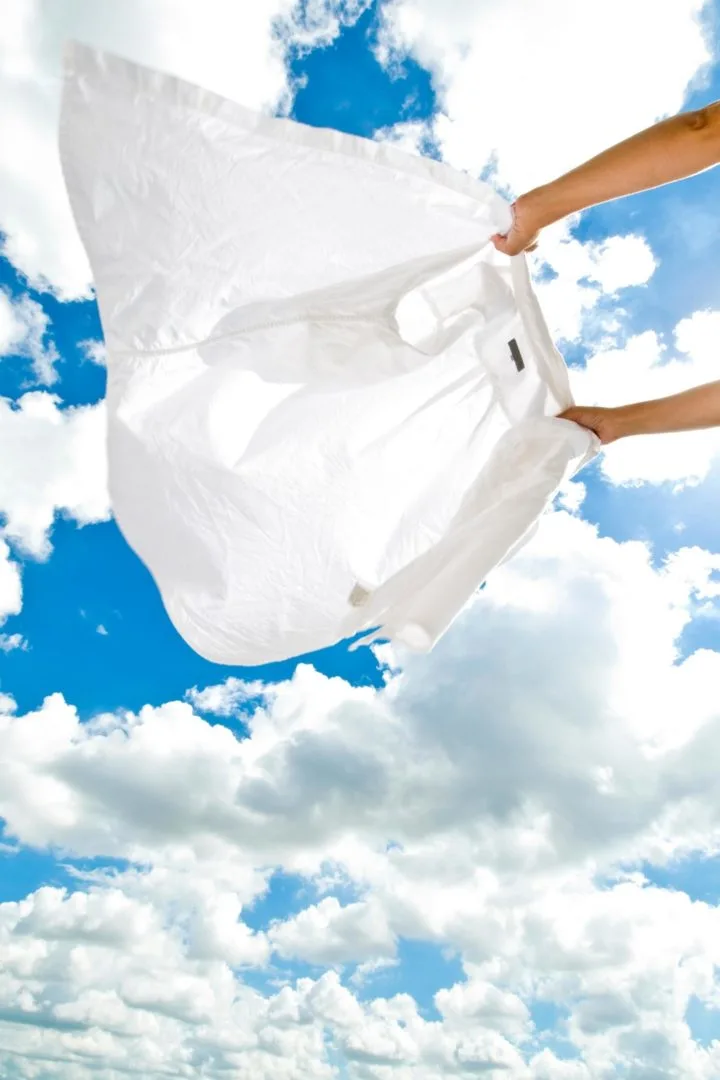 a photo of a white shirt against the sky