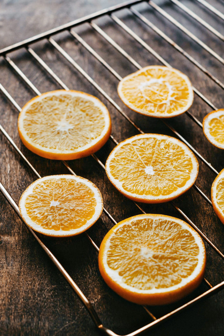 photo of orange slices on a baking rack to make dried orange slices
