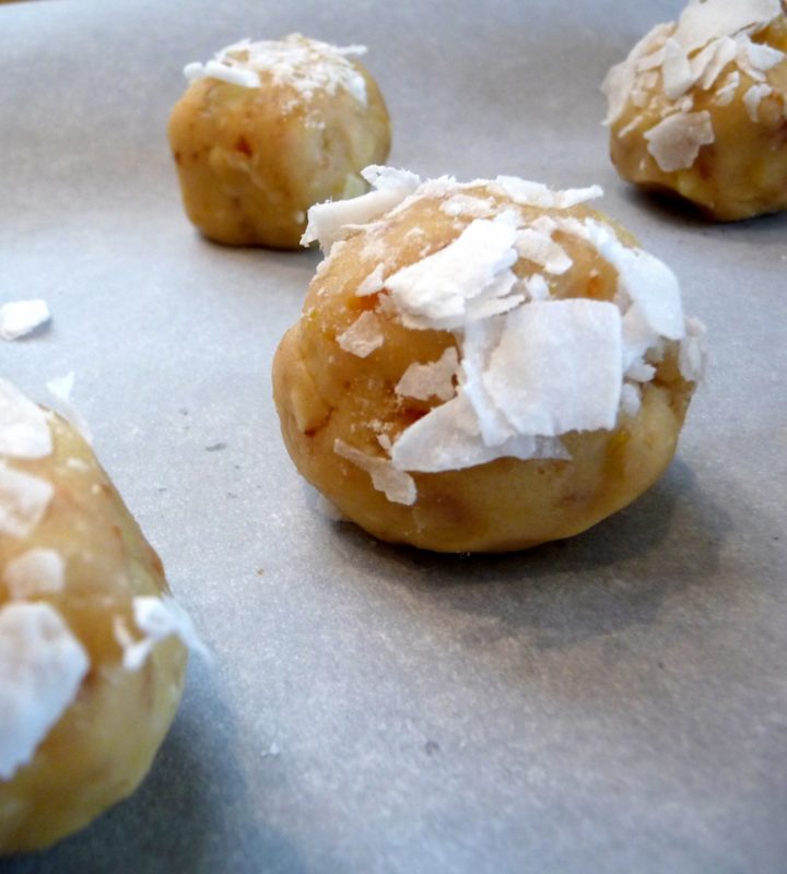 photo of lemon white chocolate cookie dough rolled into balls