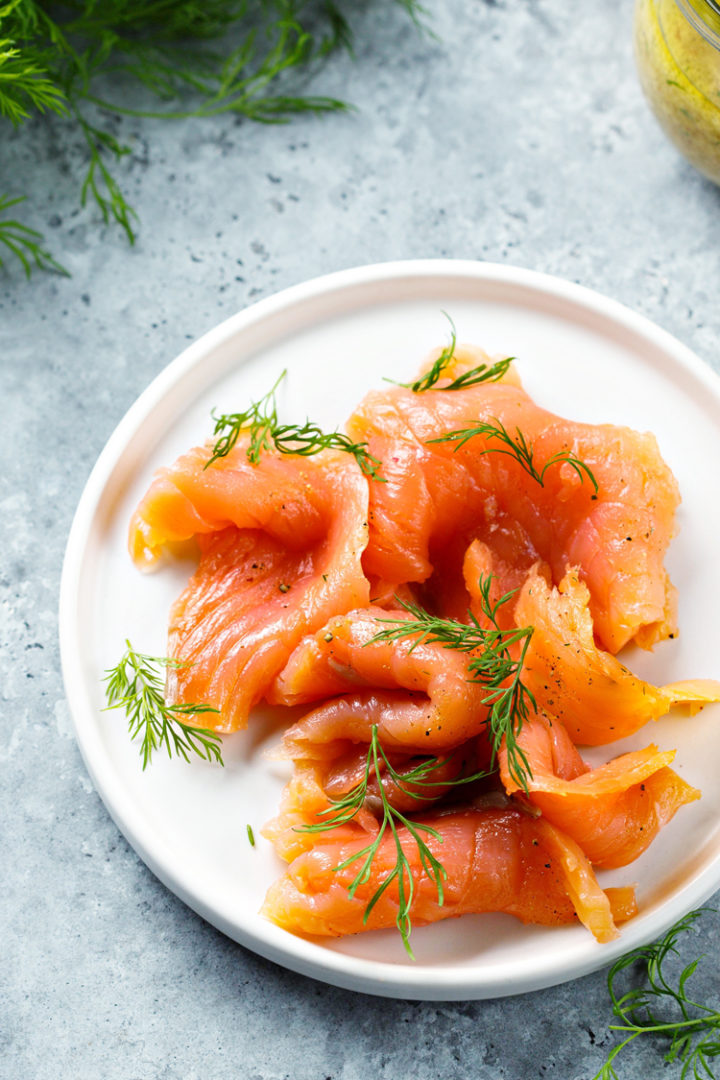 photo of norwegian salmon on a plate with fresh dill
