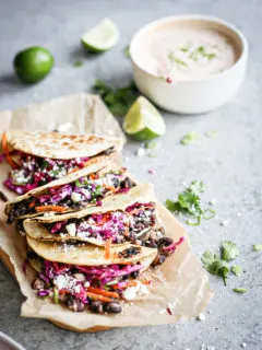 photo of Crispy Black Bean Tacos with Cilantro Lime Slaw on a cutting board