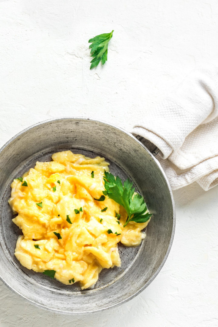 a photo of scrambled eggs in a frying pan