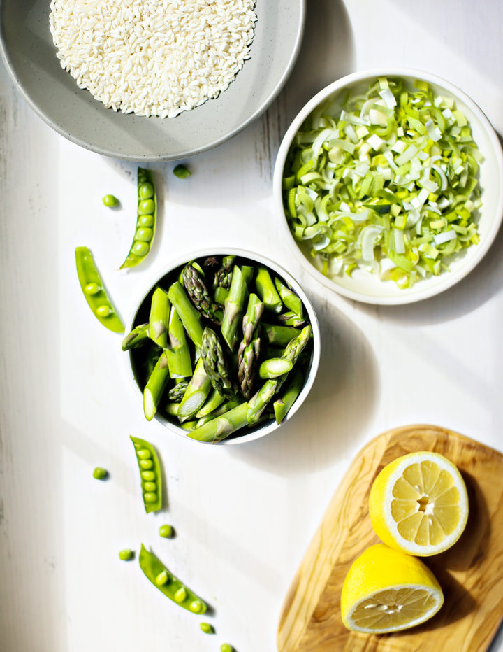 overhead photo of ingredients used in an asparagus risotto recipe