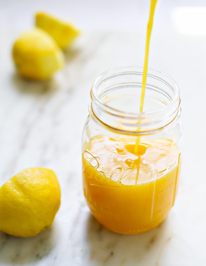 photo of lemon curd being poured into a jar