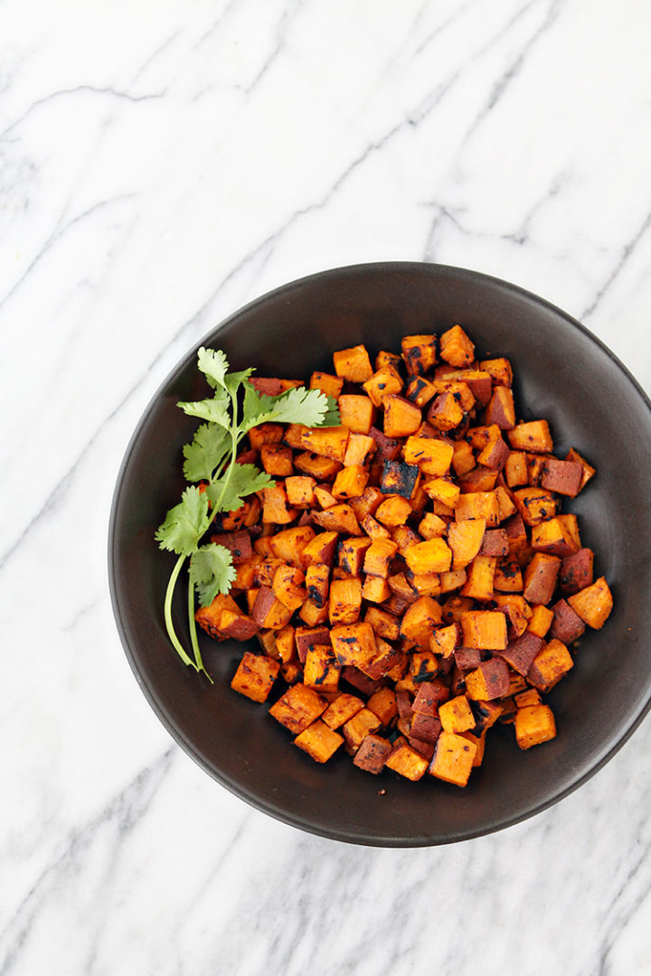 photo of grilled sweet potatoes in a black bowl