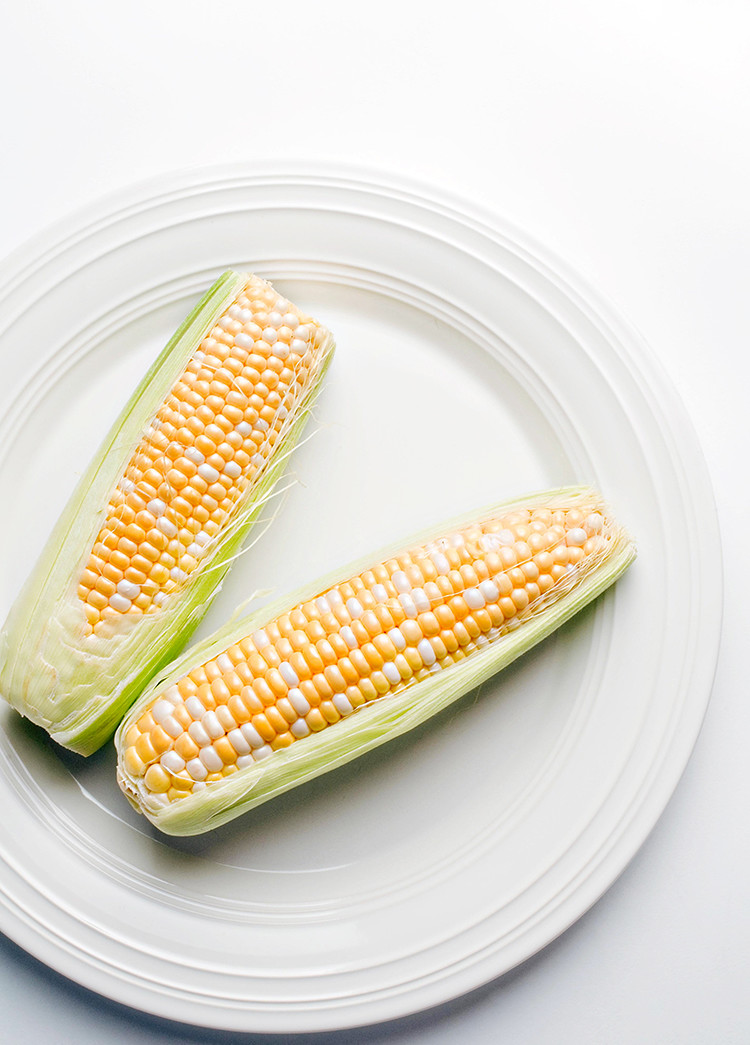 photo of corn on the cob on a plate