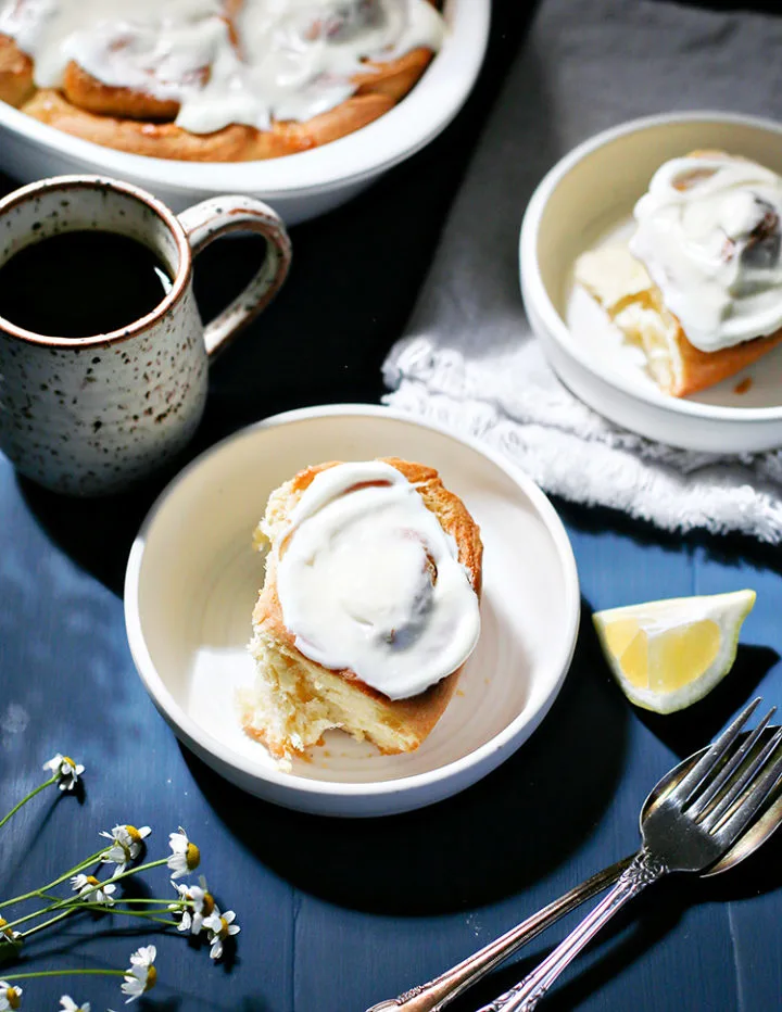 photo of a lemon roll with lemon cream cheese icing on a plate